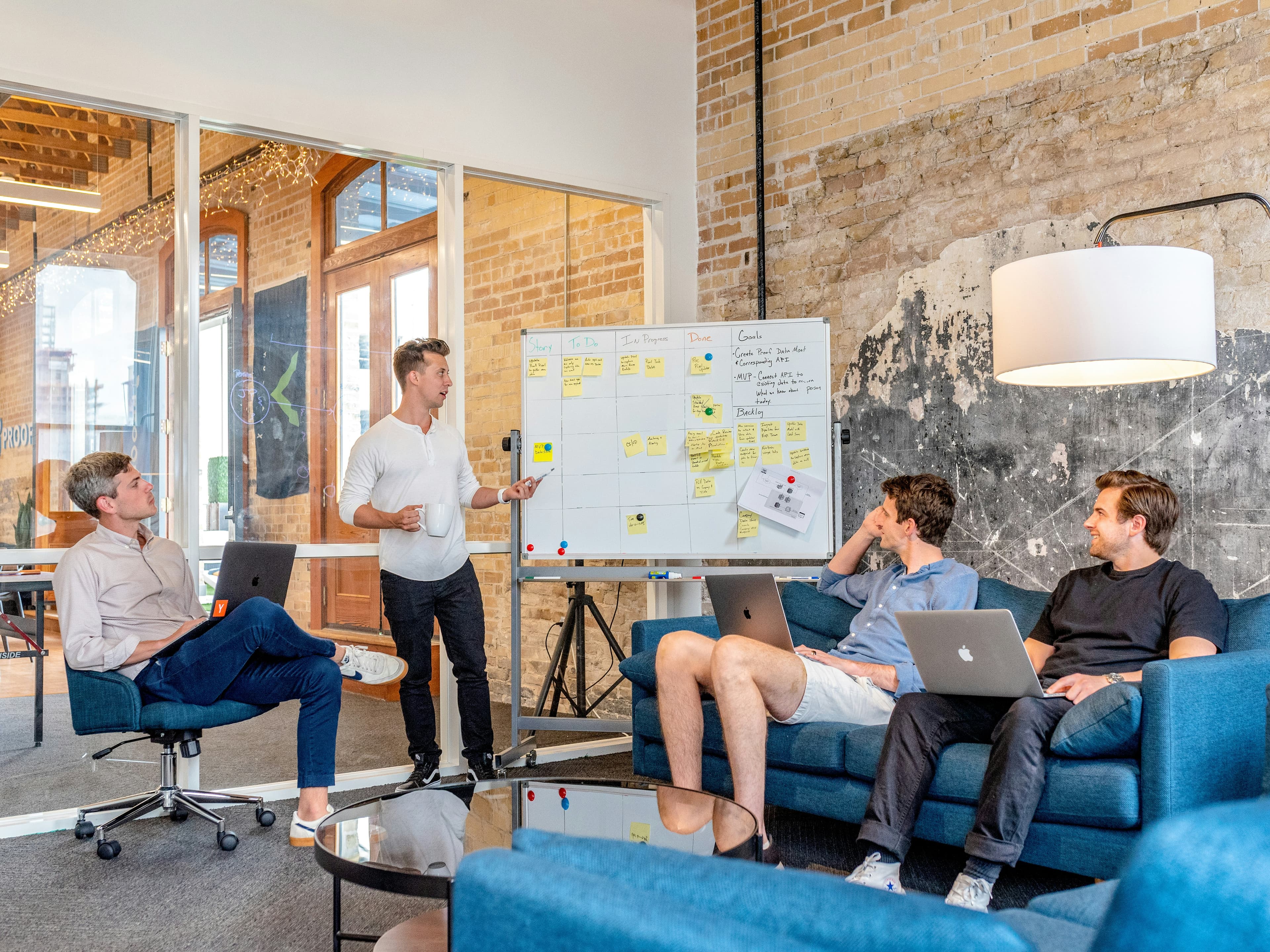 Corporate team in a business meeting discussing workplace real estate strategy
